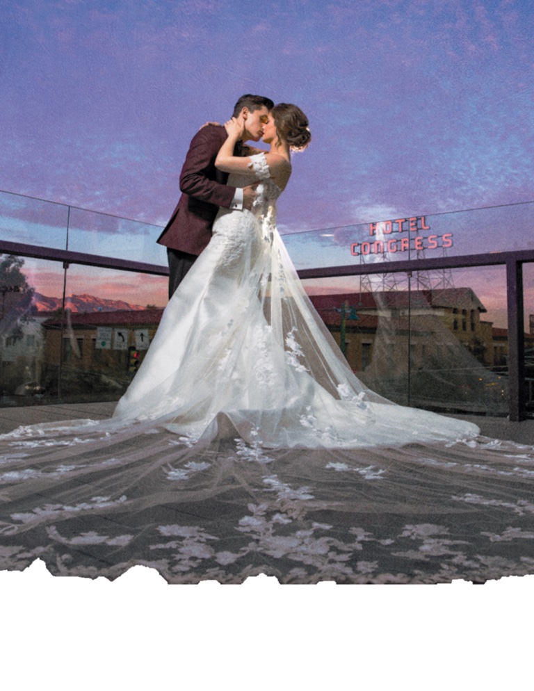 Bride and Groom kissing on rooftop